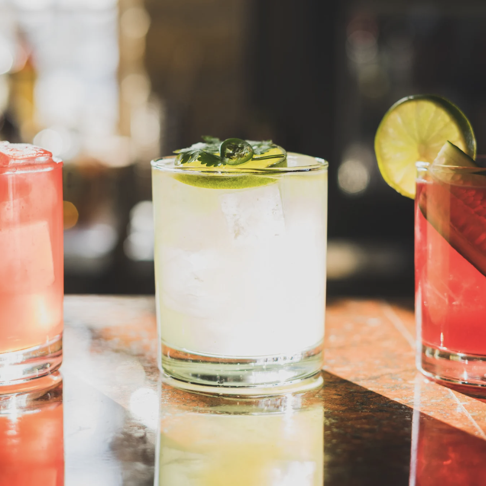 Three Margarita glass placed on a bard